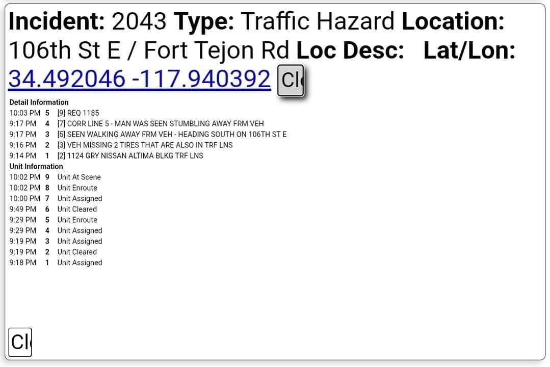 11-25....106th Street East and Ft Tejon Road....gray sedan unoccupied, blocking traffic lanes,...