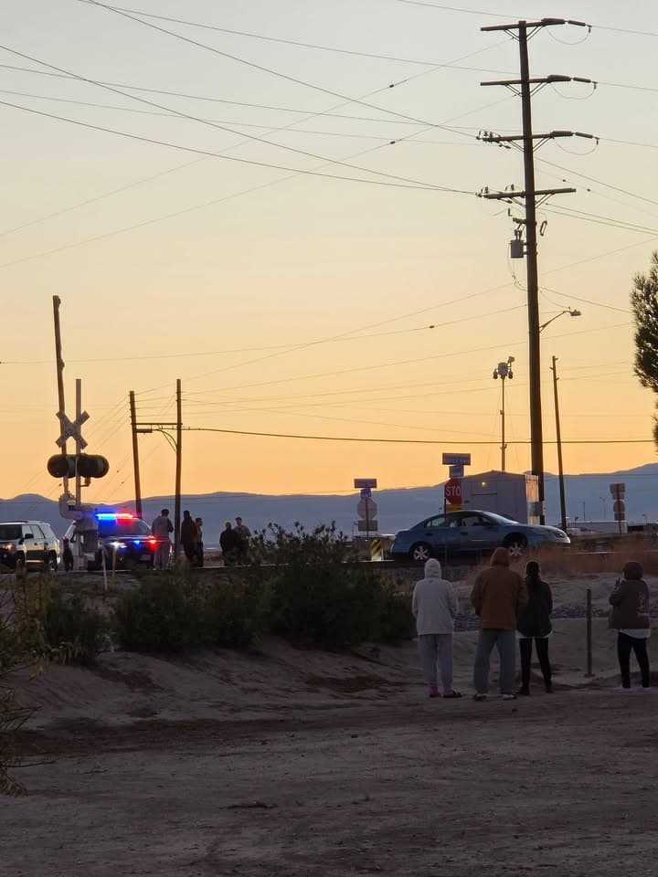 909T…Sierra Highway and Avenue E…blue sedan stuck on railroad tracks…2nd caller states...