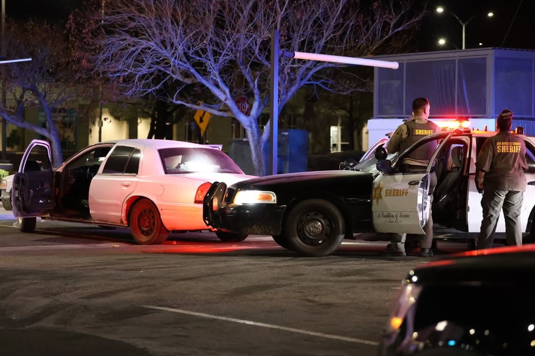 459 suspects....Beech and Avenue I at Bob's Liquor....caller caught occupants in white...